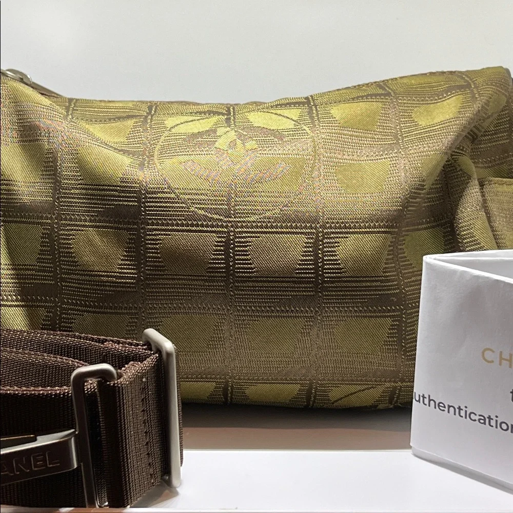 Chanel New Travel Line Mini Roll or Barrel Bag in a khaki or olive green color